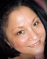 A close up of Evangelin as she smiles at the camera. She is a couples therapist in Saint Petersburg, FL. Contact her for marriage counseling in Tampa, FL and other mental health support!