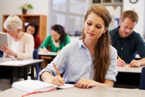 Young woman studying at an adult education class