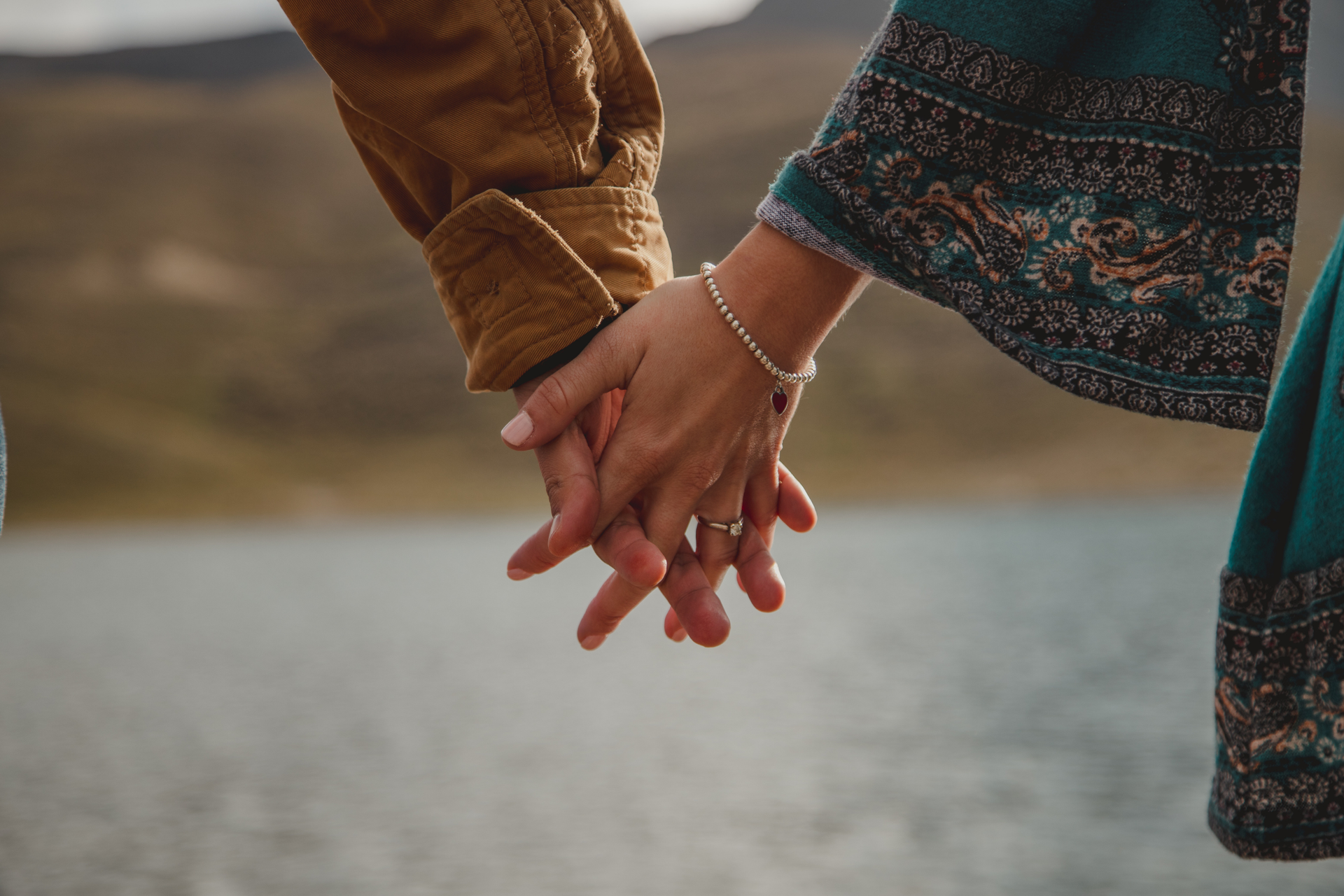 man and woman holding hands